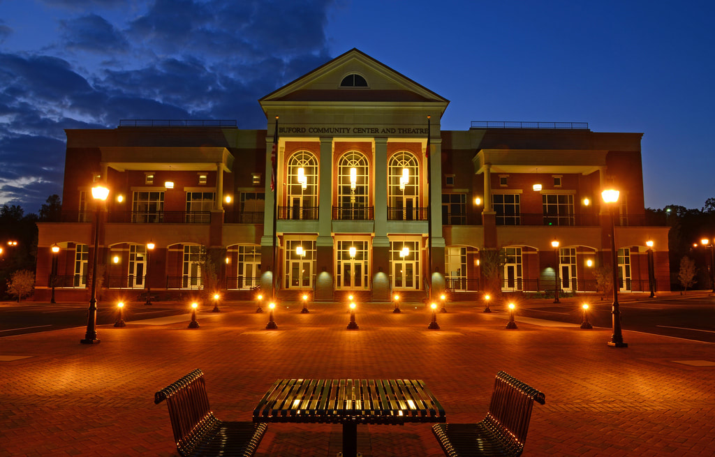 Exterior of a large brick building at night