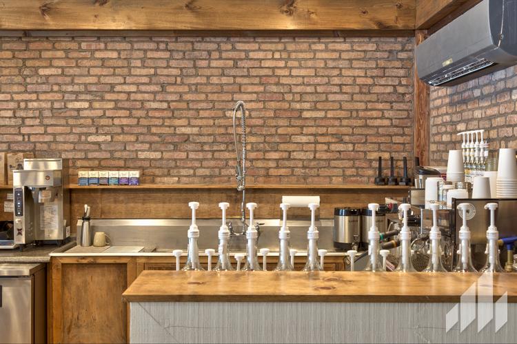 Think brick behind a coffee bar